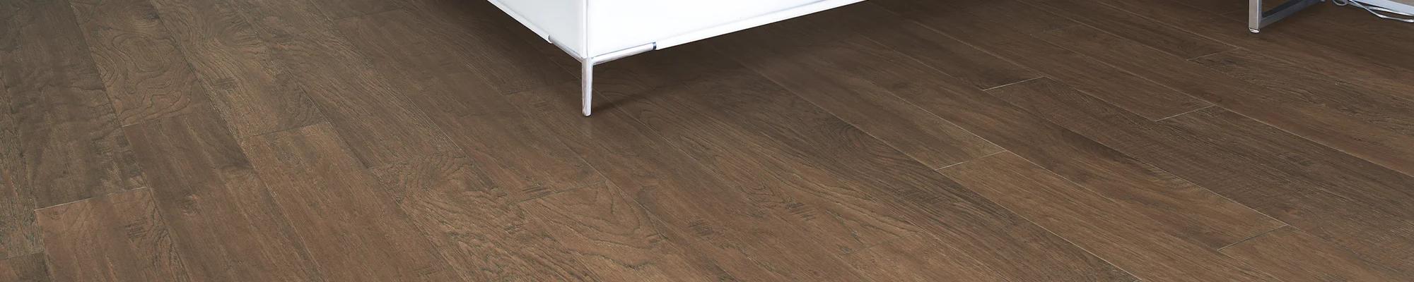 White sofa on a dark hardwood floor