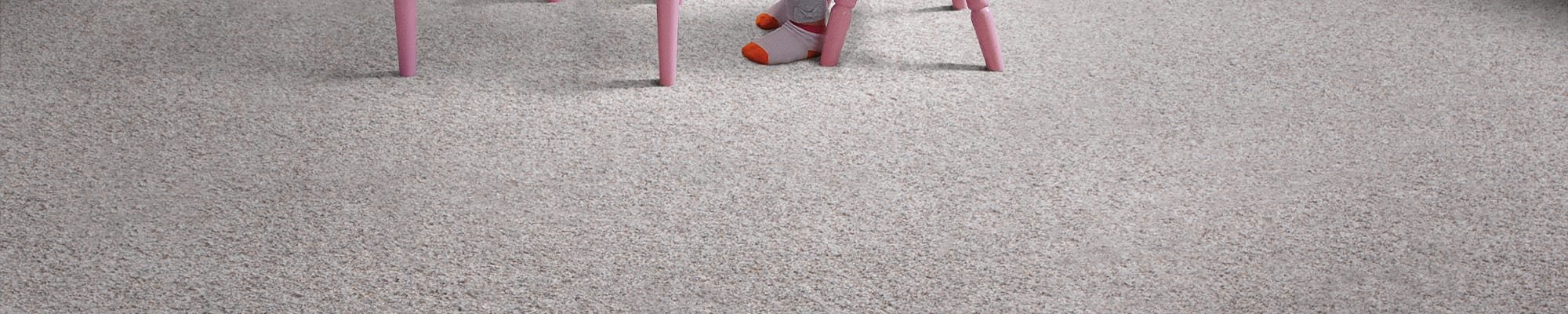Child playing on soft carpet flooring