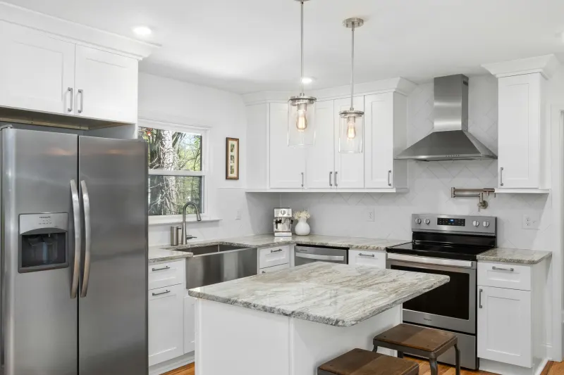 Remodeled kitchen with white cabinets and marble countertops in Arizona